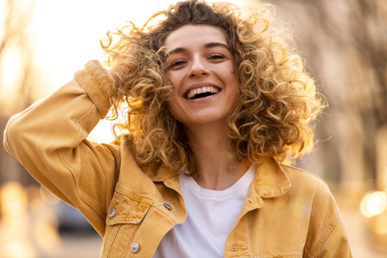General Preventative & Restorative Dentistry Services A woman smiling confidently—highlighting the importance of quality dental care.